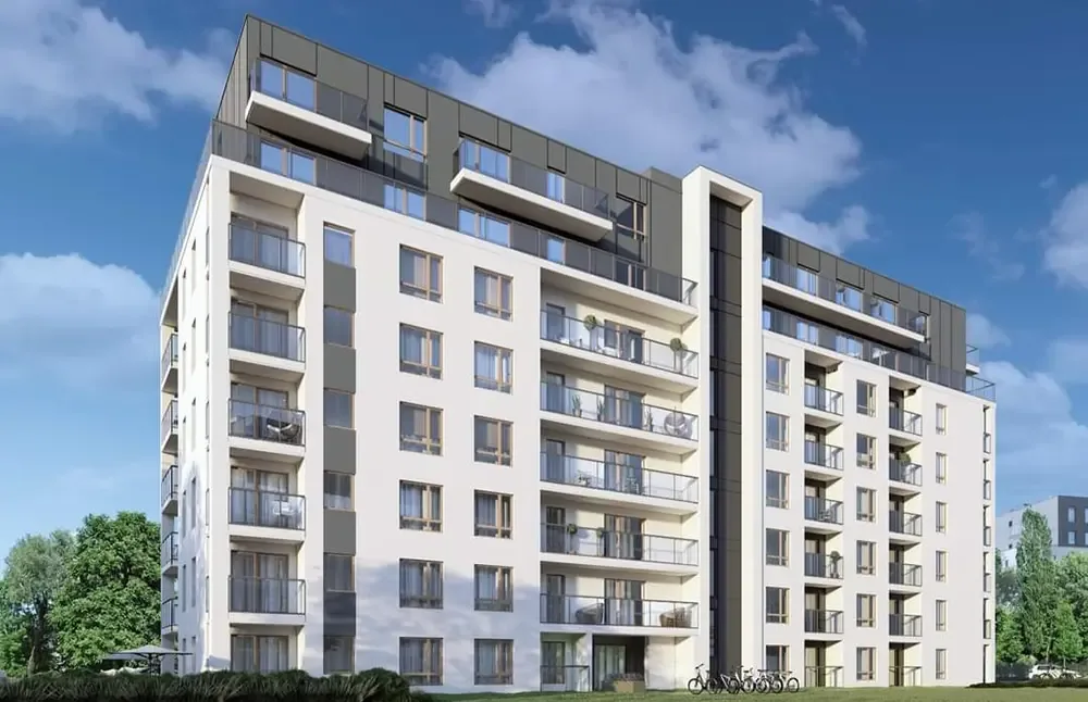 Realizacja Mako — biały apartamentowiec z przeszkleniami balkonów